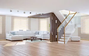 a living room with white furniture and wooden floors