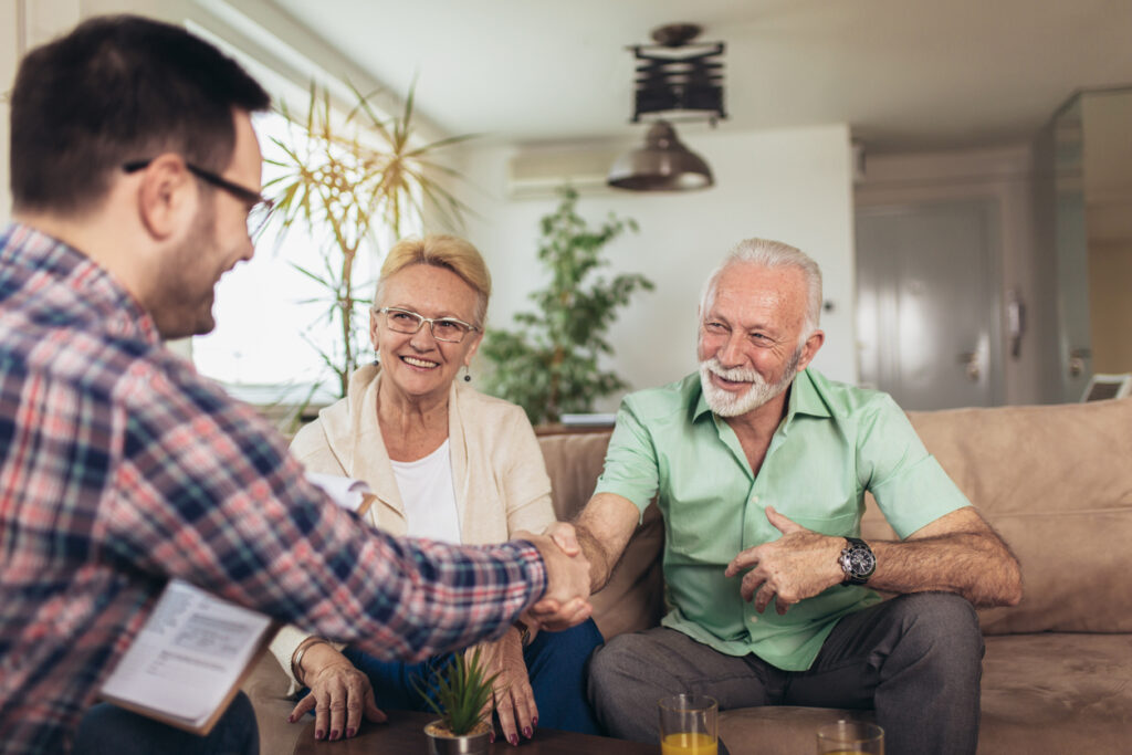 Older adult couple consulting with insurance agent